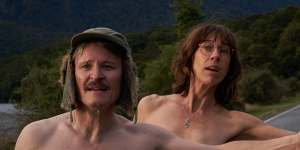 An “unhinged delight”:Damon Herriman as Bruno and Jackie van Beek as Laura hitch a ride in the New Zealand comedy Nude Tuesday.