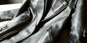 A leather jacket studded with silver buckles and zips that was worn by Bon Scott.
