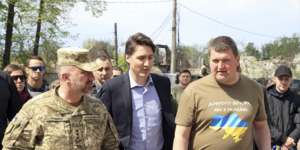 Canadian Prime Minister Justin Trudeau walking with Mayor Oleksandr Markushyn (right) in Irpin,Ukraine,on Sunday.