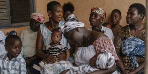 Mothers and babies waiting for shots in Accra,Ghana.