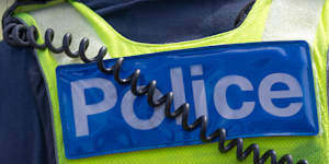 A woman appears to have fallen onto a man standing below a building on William Street just before midday on Monday,March 23,2026.