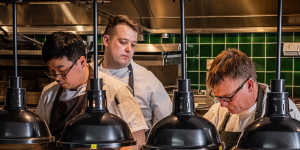 Chefs on the pass of the pub’s new open kitchen.