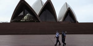Police patrol around the Sydney Opera House as mask-wearing outside became mandatory across NSW during a COVID-19 lockdown in Sydney on August 23,2021.