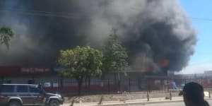 Fires amid looting in Port Moresby.