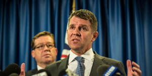 'I got it wrong':Premier Mike Baird with Deputy Premier Troy Grant at the press conference on Tuesday. 