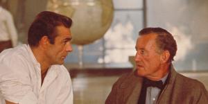 Sean Connery and author Ian Fleming discuss the character of James Bond while filming an interior scene for ‘Dr No’ at Pinewood Studios.