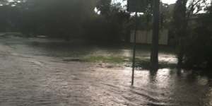 Flash flooding at Yeronga’s Orient Street Park on May 12,2021,threatens homes. Residents say illegal fill behind a nearby industrial property prevents floodwaters from getting away quickly. 