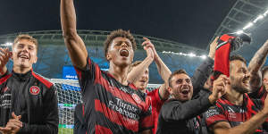 Kusini Yengi leads the celebrations after a Sydney derby win for the Wanderers in 2022.