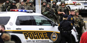 Police secure the area after a man opened fire at a synagogue in Pittsburgh.