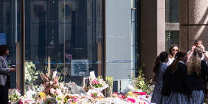 Flower tributes outside St Andrew’s Cathedral School on Monday.