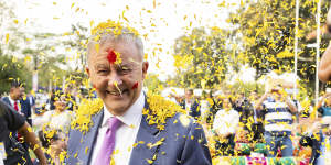 Albanese was greeted on Wednesday night with a shower of flower petals at a Holi celebration. 