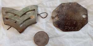 Items found last week in an Egyptian desert,including the ID tag of Sgt John Campbell Daley.