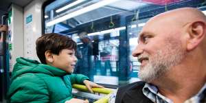 Tod Sarina and son Daniel,7,from Windsor Downs,on a metro train.