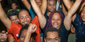 People’s Alliance supporters celebrate Sitiveni Rabuka’s return to the top job in Suva,Fiji.