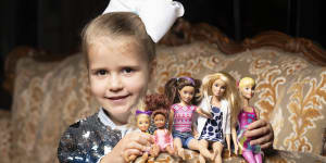 Maddison Gainge,5,with her favourite Barbie dolls. At a high tea at the Casula Powerhouse,guests were invited to bring their favourite dolls. 