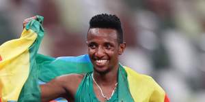 Selemon Barega celebrates winning gold in the 10,000m.