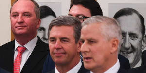 Barnaby Joyce (left) behind Nationals leader Michael McCormack (right) at a party room meeting in February 2018,after Mr Joyce was forced to resign from the leadership.