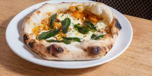 Pizza with pumpkin,stracciatella,pine nuts and fried sage.