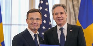 US Secretary of State Antony Blinken,right,and Swedish Prime Minister Ulf Kristersson hold Sweden’s NATO Instruments of Accession at the US State Department in Washington.