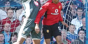 Shaka Hislop,left,takes the ball during a 2004 game between Portsmouth and Manchester United.