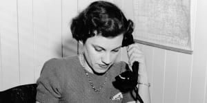 An operator works the phones of Queensland’s Country Exchange Service in 1952.
