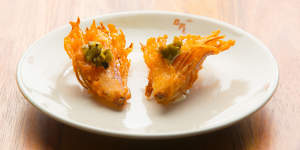 Like a bloomin'onion in miniature:fried shallot with jalapeno cashew sour cream