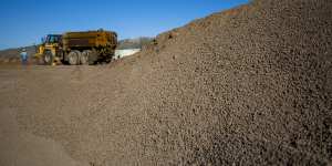 A mountain of crushed ore awaits processing by America's only rare earths producer,MP Materials,in California.