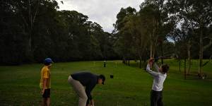 Young golfers at a coaching clinic ran by Brad Fasher at Lane Cove Country Club,which will be affected by a proposed new sporting complex.