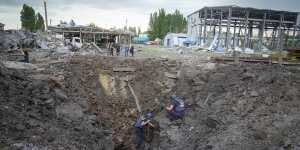 Police members inspect a crater caused by a Russian rocket attack in Pokrovsk,Donetsk region,Ukraine,on Wednesday.