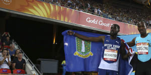 Kyron Mcmaster of the British Virgin Islands,left,and the Bahamas'Jeffery Gibson celebrate their gold and silver medals in the men's 400m hurdles final.