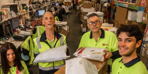 Sarah Sevian,Brian Howley and Jim and Jack Gray at Australia Post’s North Melbourne delivery centre.
