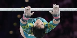 Georgia Godwin of Australia performs on the uneven bars during the women’s all-around finals.
