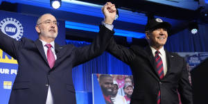 President Joe Biden stands with Shawn Fain,president of the United Auto Workers,at the union’s political convention.