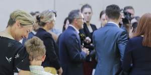 Lucy Quarterman,and her children Luca and Ben,watched Richard Di Natale resign as Greens leader on Monday. 