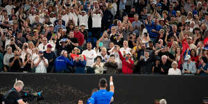 Novak Djokovic points to a heckler after defeating Tomas Machac in the third round.