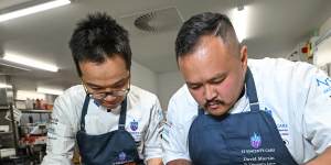 Aged care chefs Harry Shen (left) and David Martin put the final touches on meals at St Vincent’s Care Services Kew.