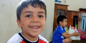 All smiles:A young boy at the learning centre.