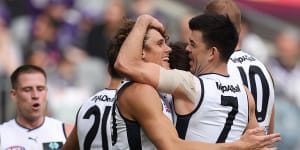 Carlton celebrate a goal against Fremantle.