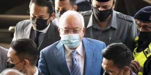 Former Malaysian prime minister Najib Razak,centre,arrives at Kuala Lumpur High Court in February.
