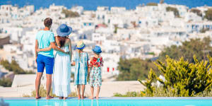 Family of four on european vacation on the edge of pool One time use for Traveller only Credit:Getty For family travel sheriden rhodes