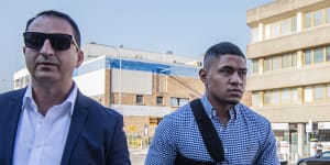 Manase Fainu,right,arrives at Liverpool police station in 2019 along side his manager Mario Tartak.