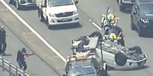 'Armed carjackers'charged after flipping car on Bruce Highway