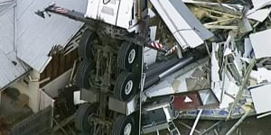 'We saw the house cave in':Family's lucky escape after crane collapses on home