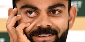 Mitchell Johnson gives Kohli a whack