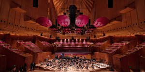 The Sydney Opera House’s Concert Hall. now has “petals” that replace the old plastic”doughnuts” above the orchestra stage following a refurbishment.