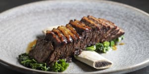 Beef short ribs with sauteed kale.