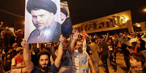 Followers of Shiite cleric Muqtada al-Sadr celebrate in Tahrir Square in Baghdad early on Monday,May 14.