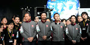Takeshi Hakamada,centre,founder and chief executive of ispace and his team.