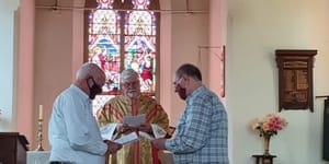 A bishop blesses the civil union of Fr John Davis and Fr Rob Whalley