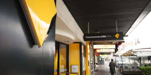 The Commonwealth Bank of Australia logo is displayed at a branch in Sydney.